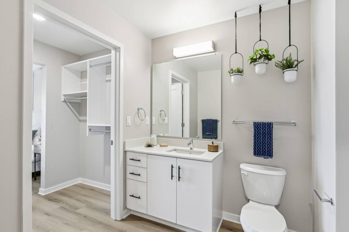 Bathroom with frameless vanity mirror at The Breeze in Winter Haven, Florida