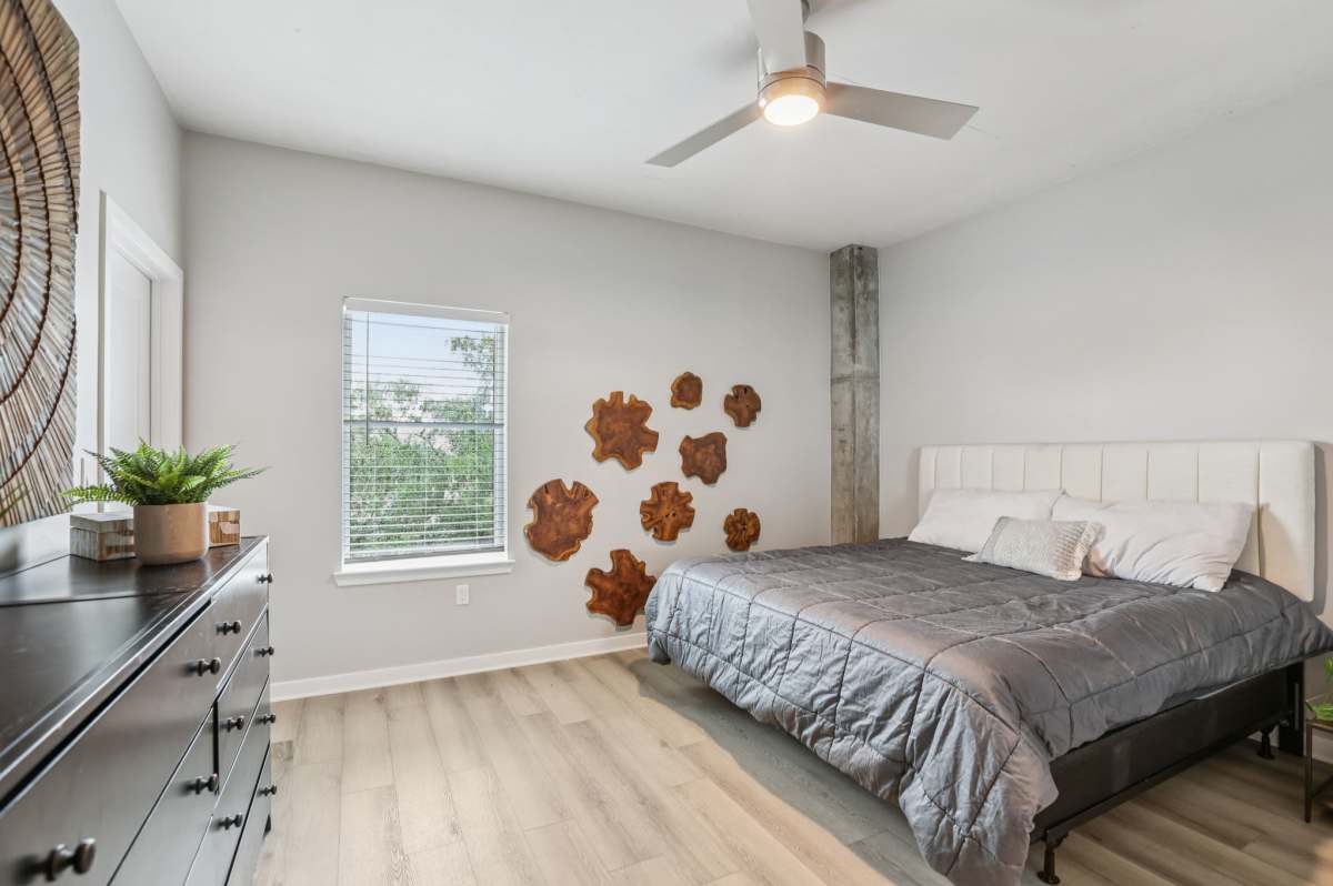 Bedroom with ceiling fan at The Breeze in Winter Haven, Florida