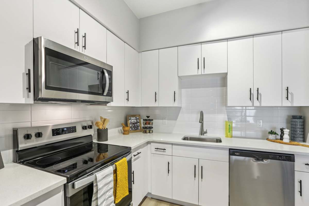 Kitchen with white cabinets at The Breeze in Winter Haven, Florida