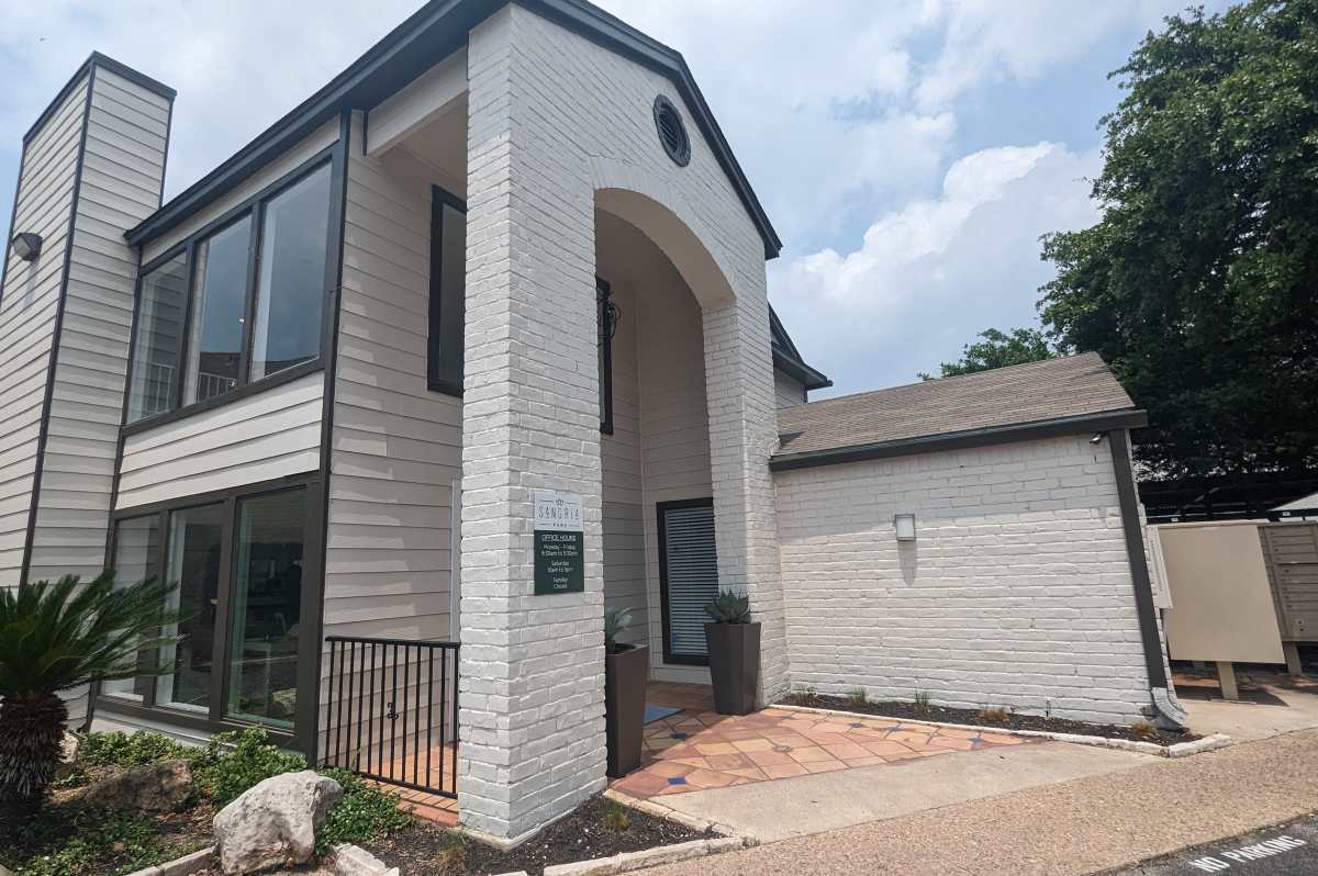 Charming exterior with modern accents and lush landscaping at Sangria in Austin, Texas. Sangria Park in Austin, Texas
