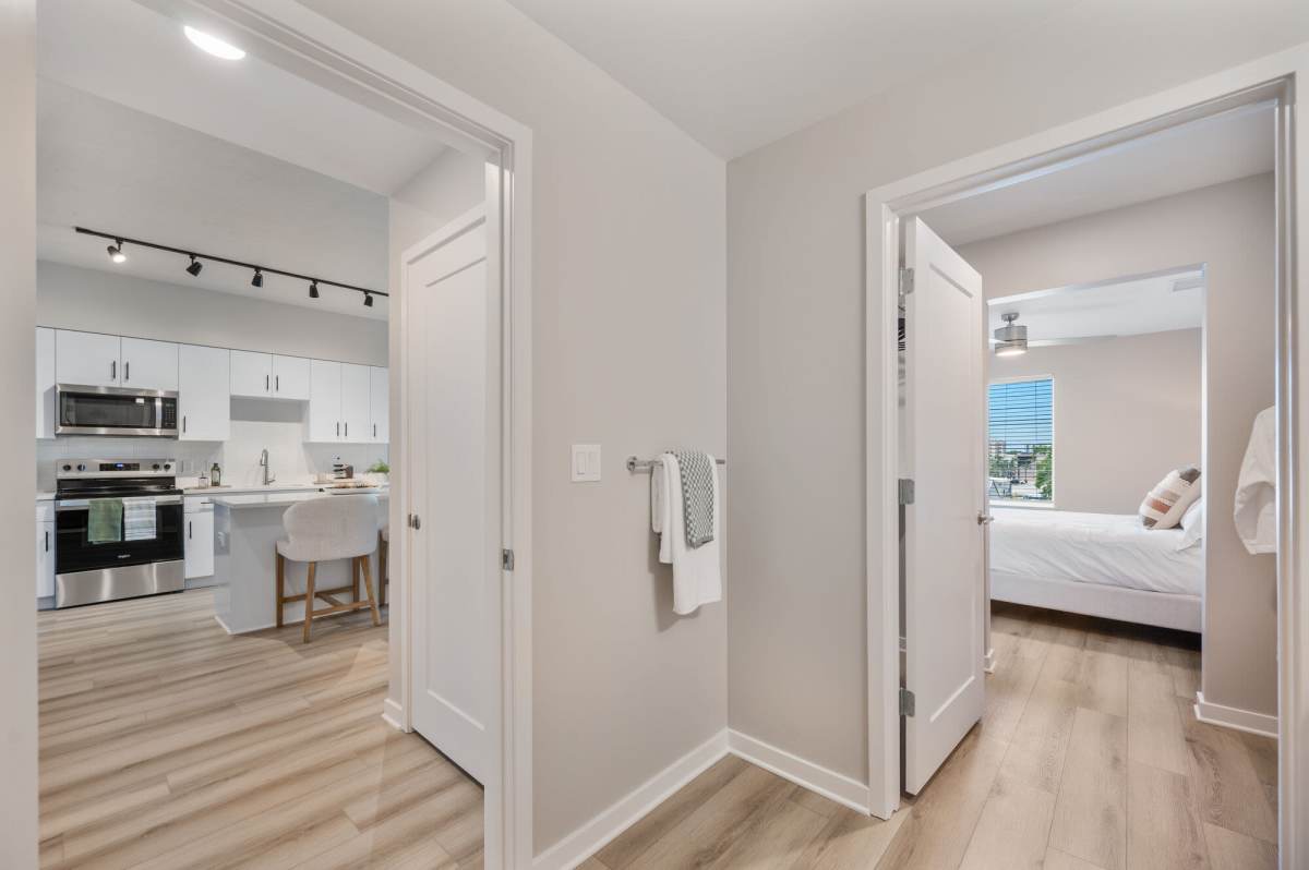 Bedroom and kitchen view at The Breeze in Winter Haven, Florida
