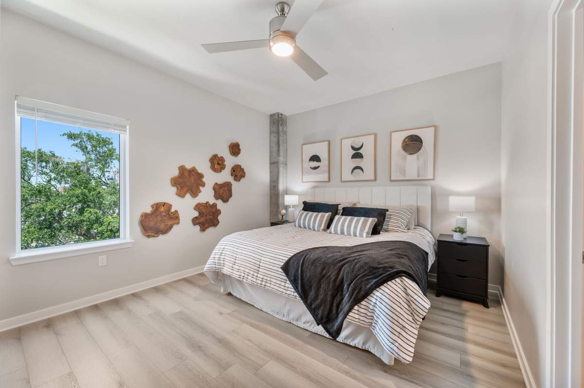 Bedroom area view with ceiling track light at The Breeze in Winter Haven, Florida