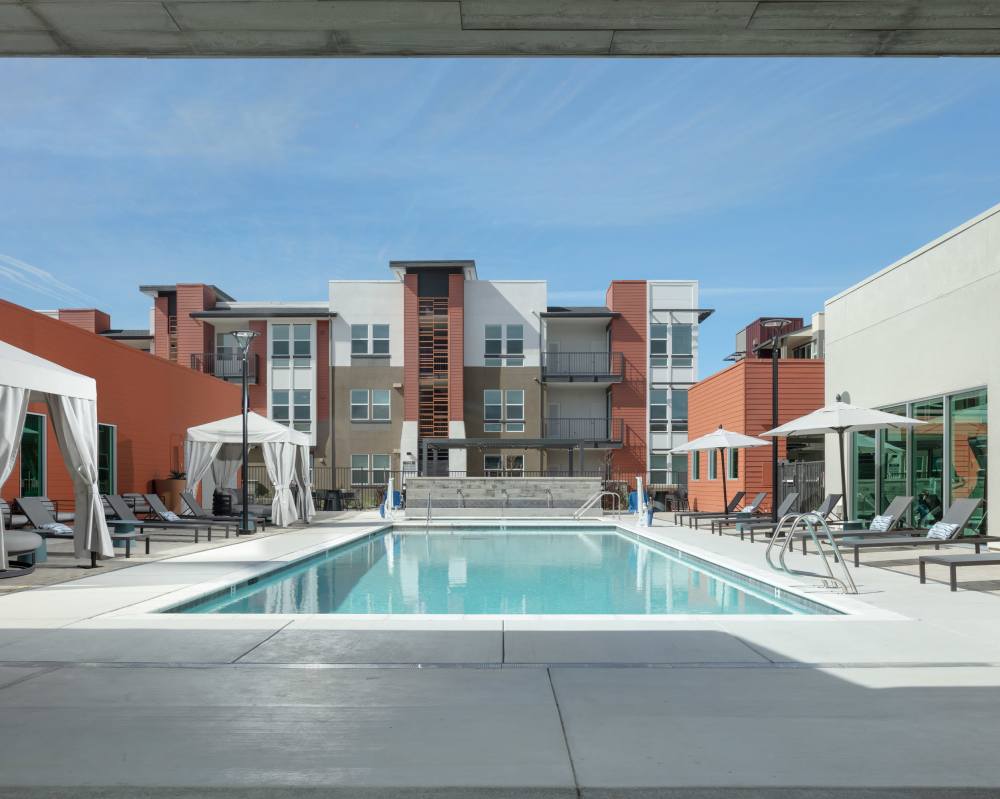 Apartments in Napa, CA for Rent - SoCo Apartments - Swimming Pool With Cabanas, Umbrellas, And Lounge Chairs
