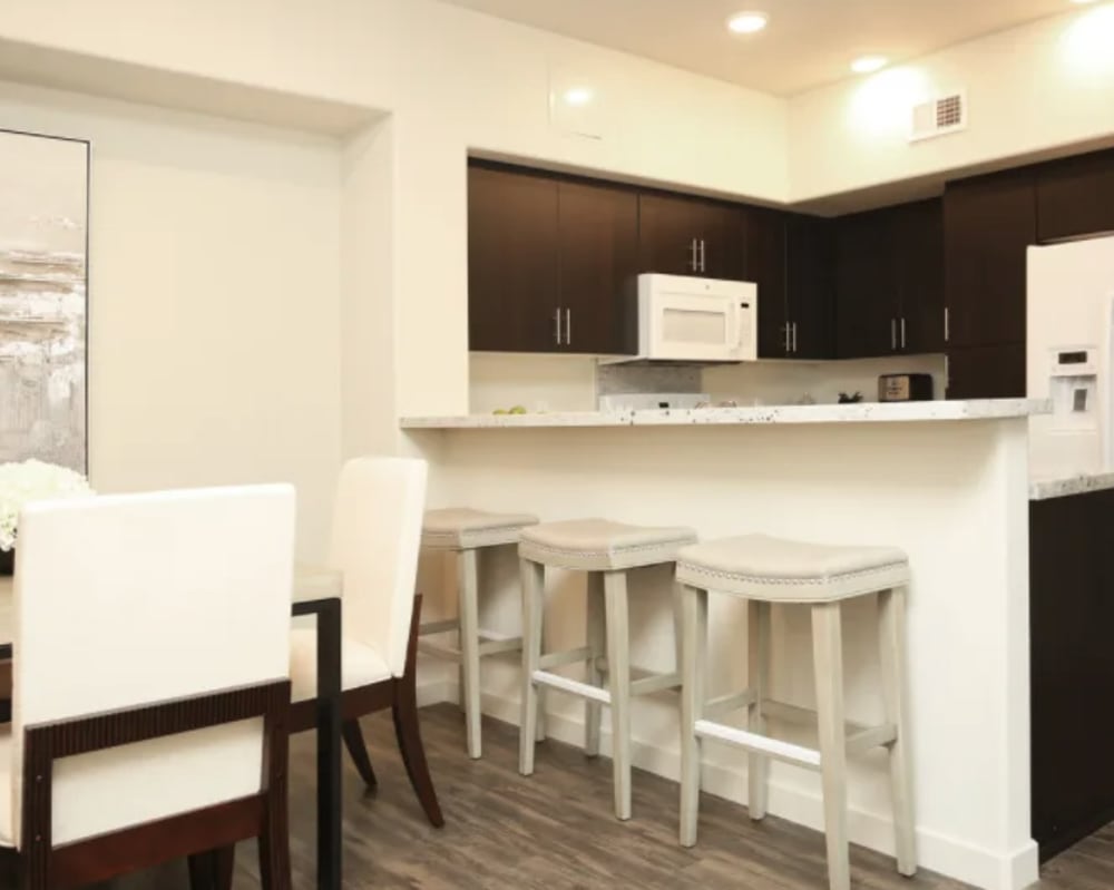 Dining room with kitchen bar stool and high chairs at Vines on 80 in Fairfield, California