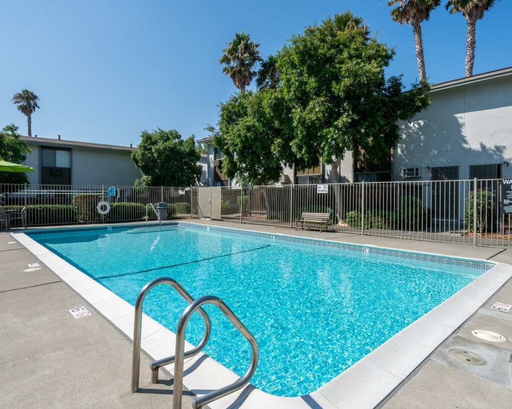 Lounge beds of a swimming pool at Autumn Oaks Apartments in Suisun City, CA