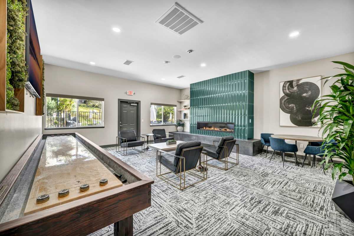 Game room with shuffleboard at Villas at D'Andrea Apartment Homes in Sparks, Nevada