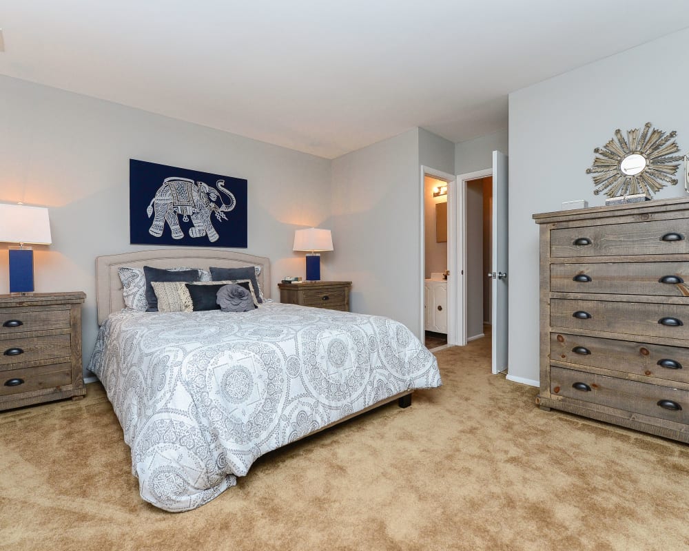 Well decorated model bedroom at Moorestowne Woods Apartment Homes in Moorestown, NJ
