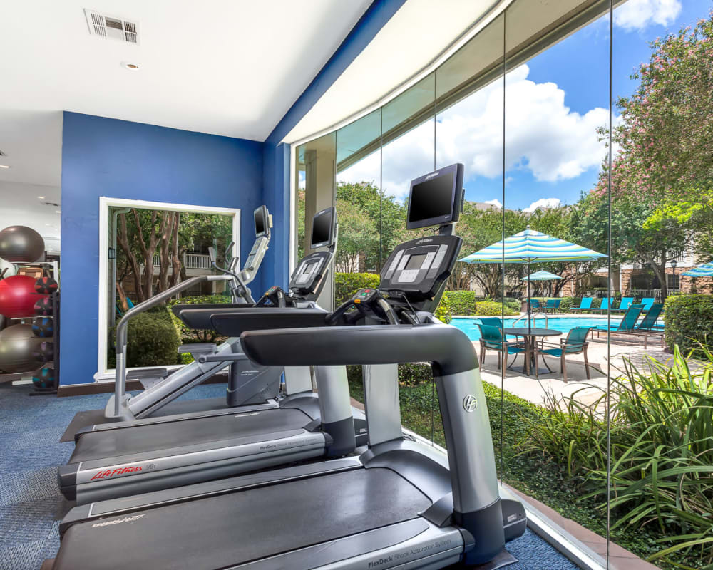 Fitness Center overlooking pool at The Lodge at Shavano Park in San Antonio, Texas