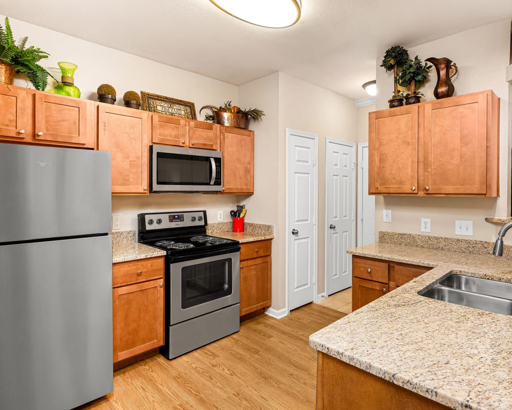 Kitchen with stainless appliances at Villas at Medical Center in San Antonio, Texas