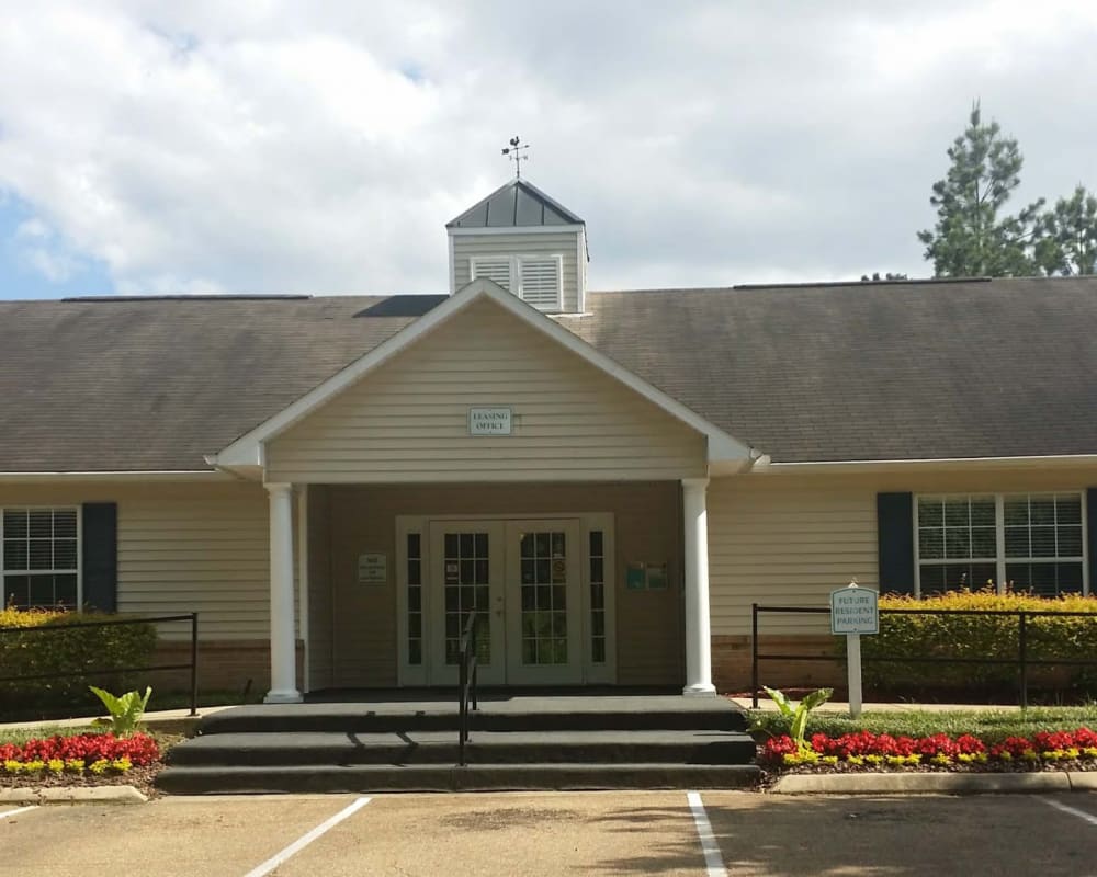 Parking in front of the leasing office at Bristol Park Apartments in Jackson, Mississippi