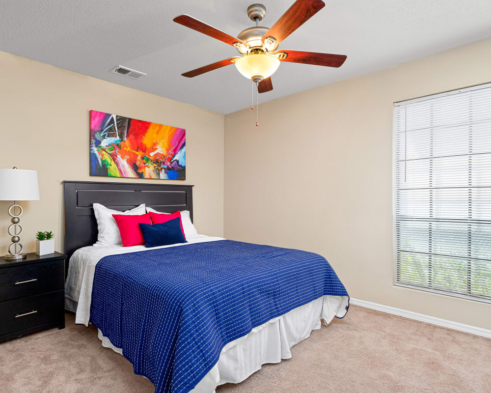 Bedroom with ceiling fan at Stoneybrook Apartments & Townhomes in San Antonio, Texas