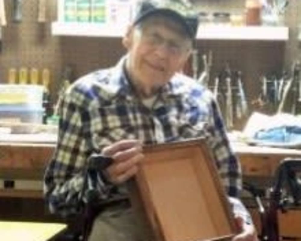 Resident Harold making memory boxes for his dare to dream event at Milestone Senior Living Eagle River in Eagle River, Wisconsin.