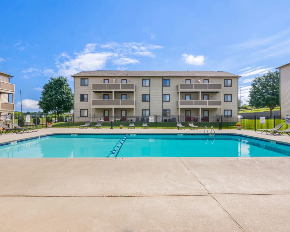 Large swimming pool with an expensive sundeck at Gable Oaks Apartment Homes in Rock Hill, South Carolina