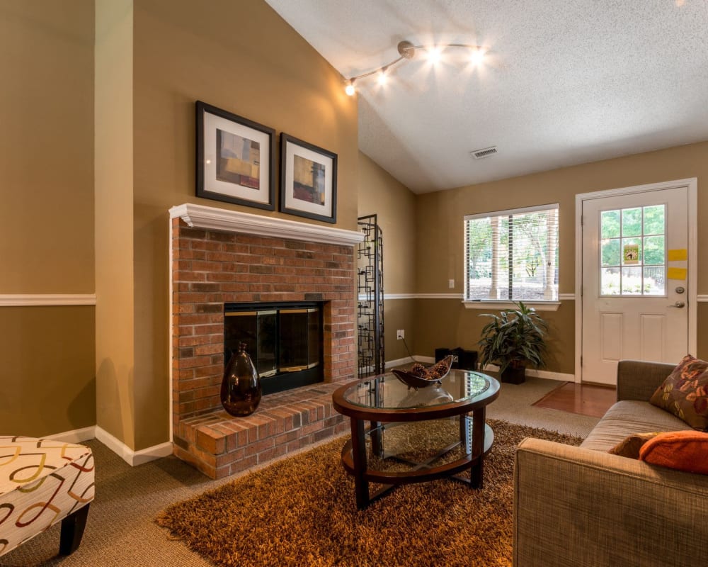 Clubhouse interior with a fireplace at Waters Edge Apartment Homes in Concord, North Carolina
