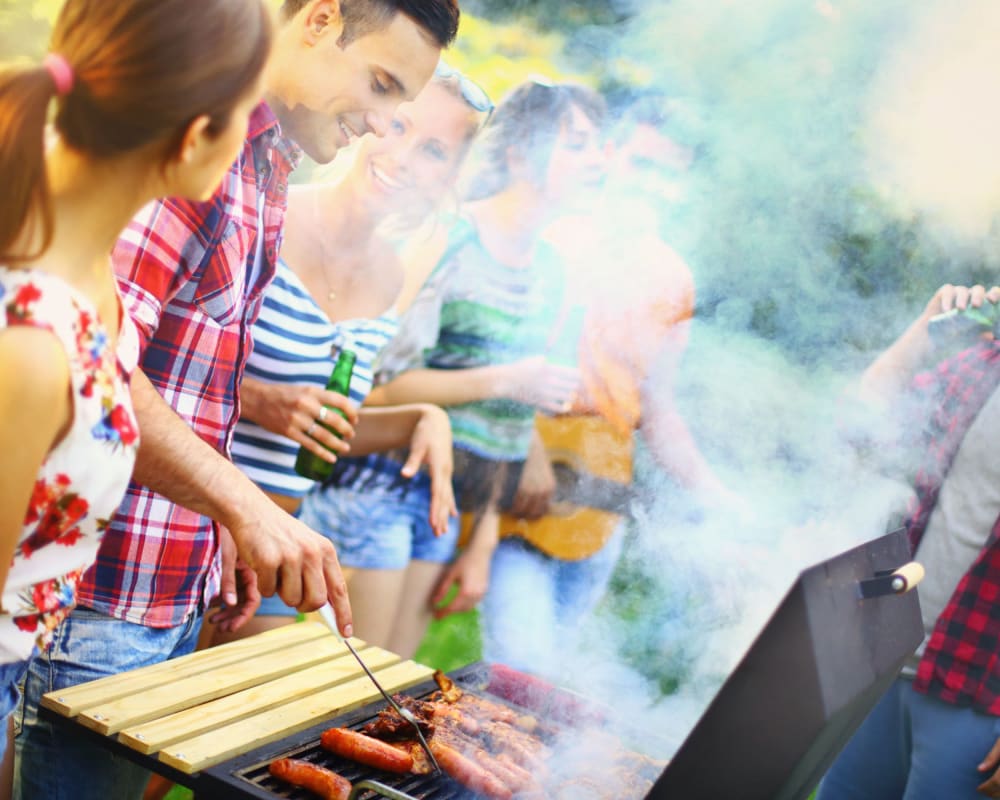 Residents grilling food at Crestone Apartments in Brighton, Colorado