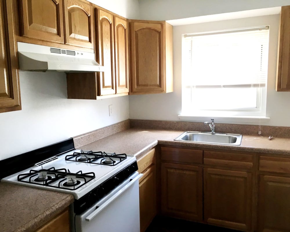 Kitchen with large window at Suburban Terrace in Hackensack, New Jersey