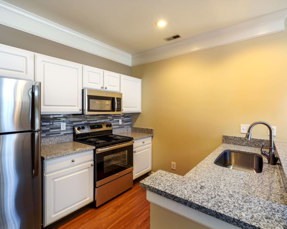 Kitchen with stainless-steel appliances in a home at Christopher Wren Apartments & Townhomes in Wexford, Pennsylvania