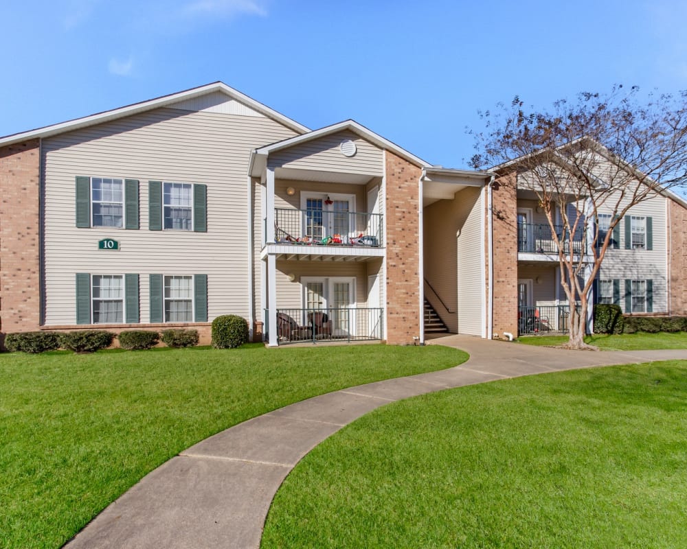 Comfortable seating and an open kitchen in the clubhouse at Bristol Park Apartments in Jackson, Mississippi