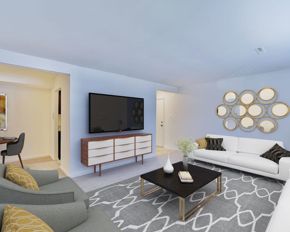Spacious living room at Village Square Apartments & Townhomes in Glen Burnie, Maryland
