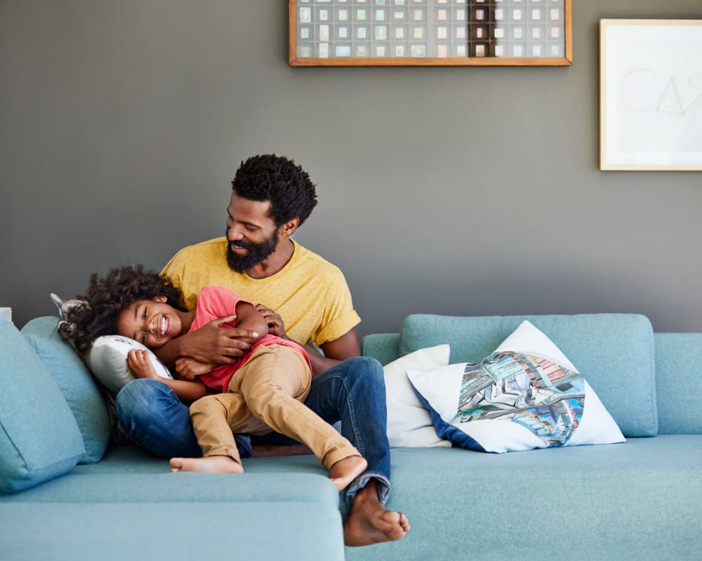 Resident and his child at St. Charles Square Apartments in Carol Stream, Illinois