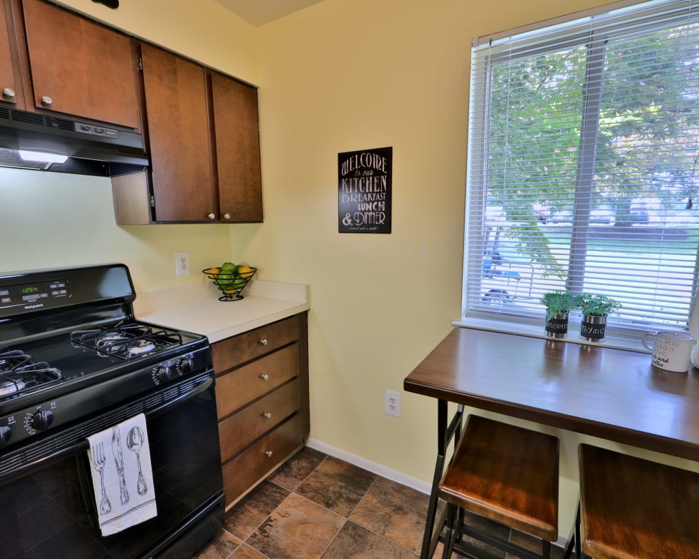 Kitchen with black appliances at Lakewood Hills Apartments & Townhomes in Harrisburg, Pennsylvania