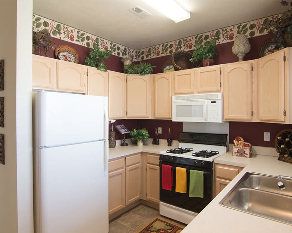 Kitchen with white appliances at Lake Pointe Apartment Homes in Portage, Indiana