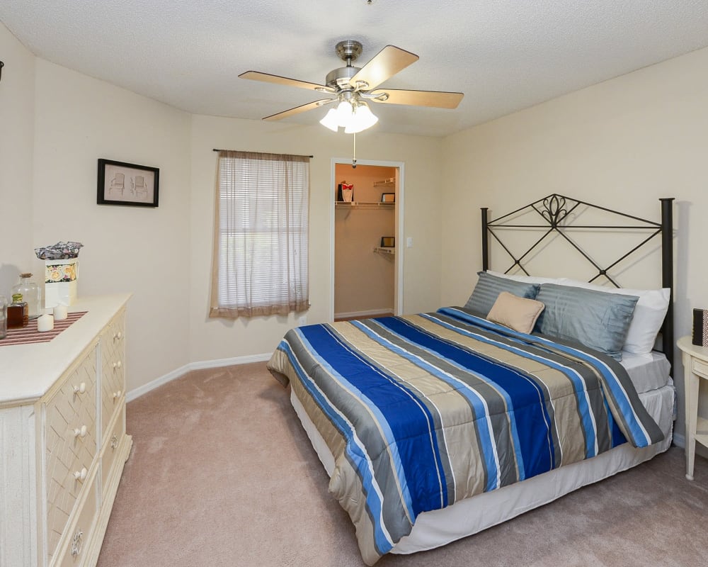 Model bedroom with a large closet at Promenade Apartment Homes in Winter Garden, Florida