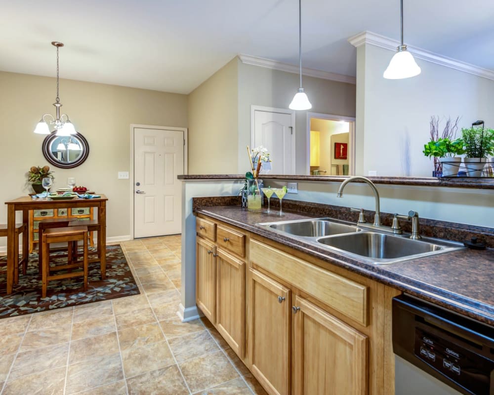 Open concept kitchen and dining area at Carden Place Apartment Homes in Mebane, North Carolina