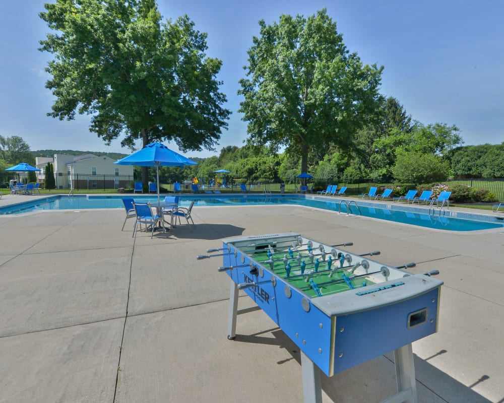 Outdoor game area by the swimming pool at The Preserve at Milltown in Downingtown, Pennsylvania