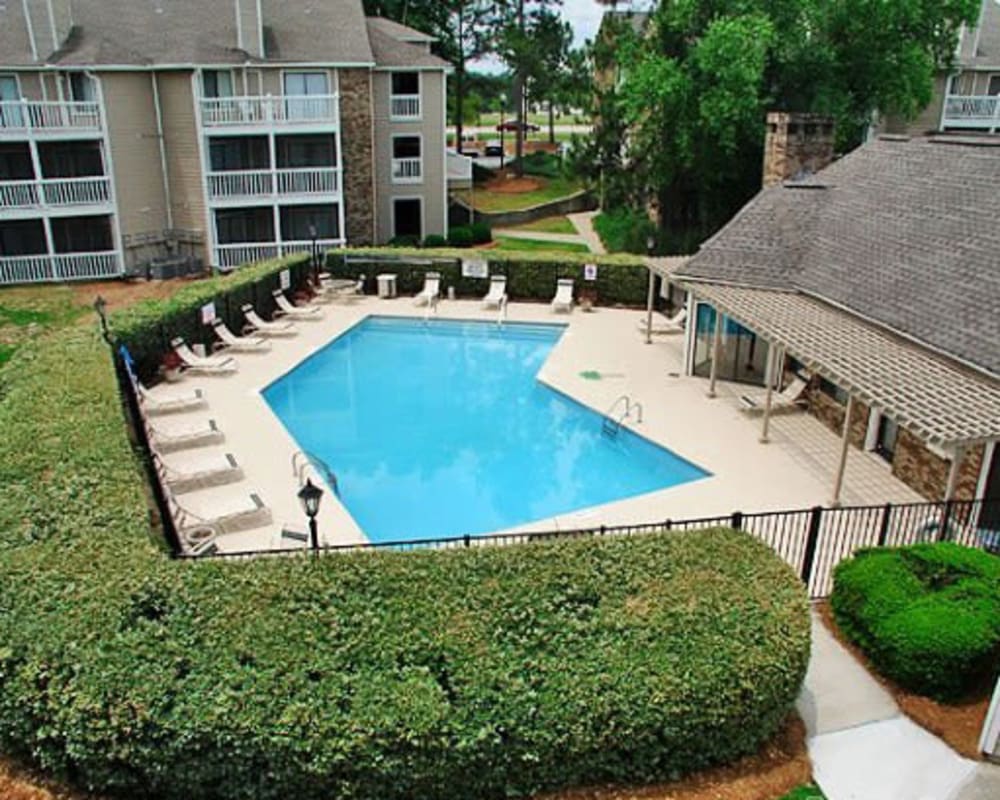Swimming pool surrounded by lounge chairs at Gable Hill Apartment Homes in Columbia, South Carolina