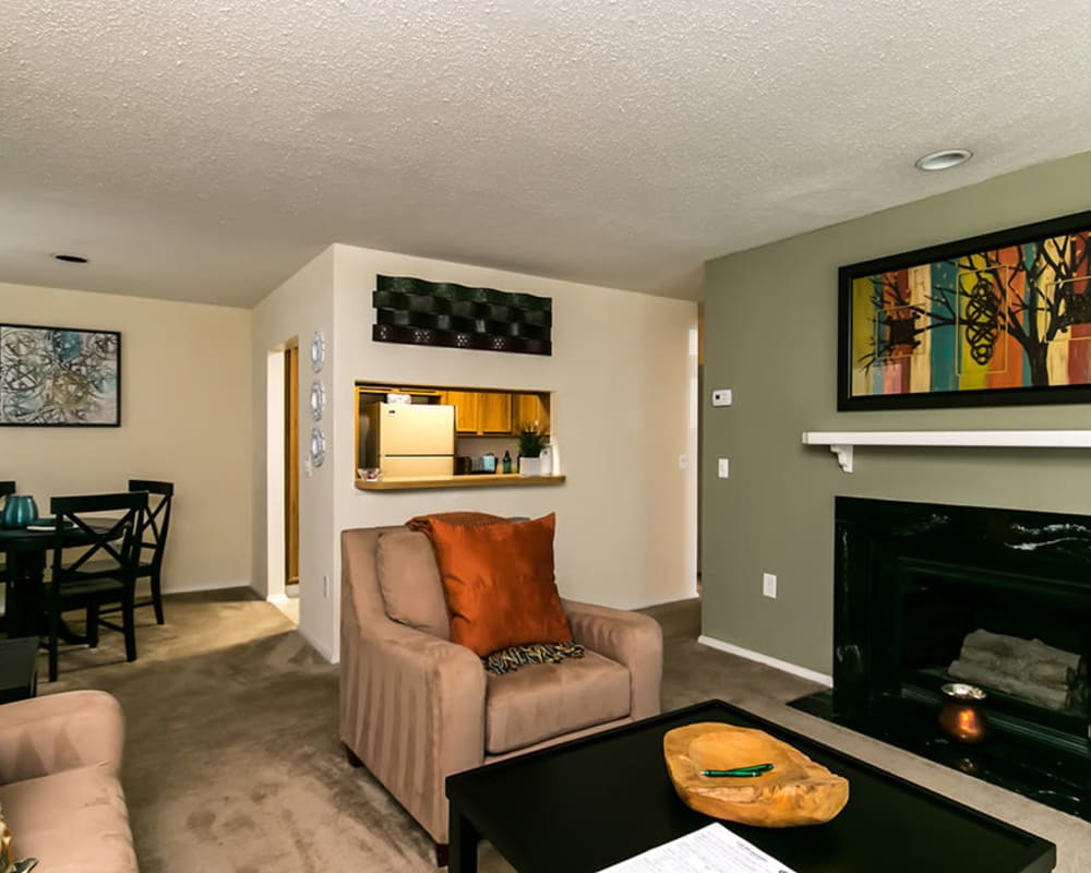 Living room with a fireplace in a model apartment home at Gable Hill Apartment Homes in Columbia, South Carolina