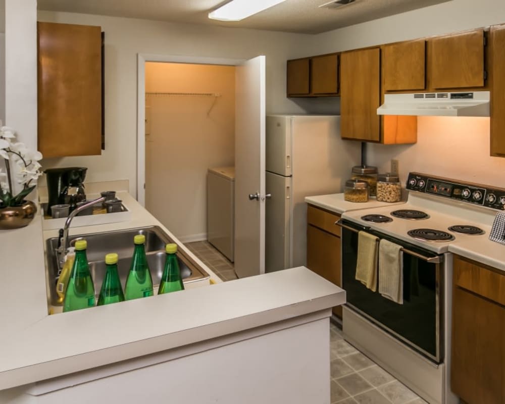 Fully equipped kitchen and a laundry room with washer and dryer included at St. Andrews Commons Apartment Homes in Columbia, South Carolina