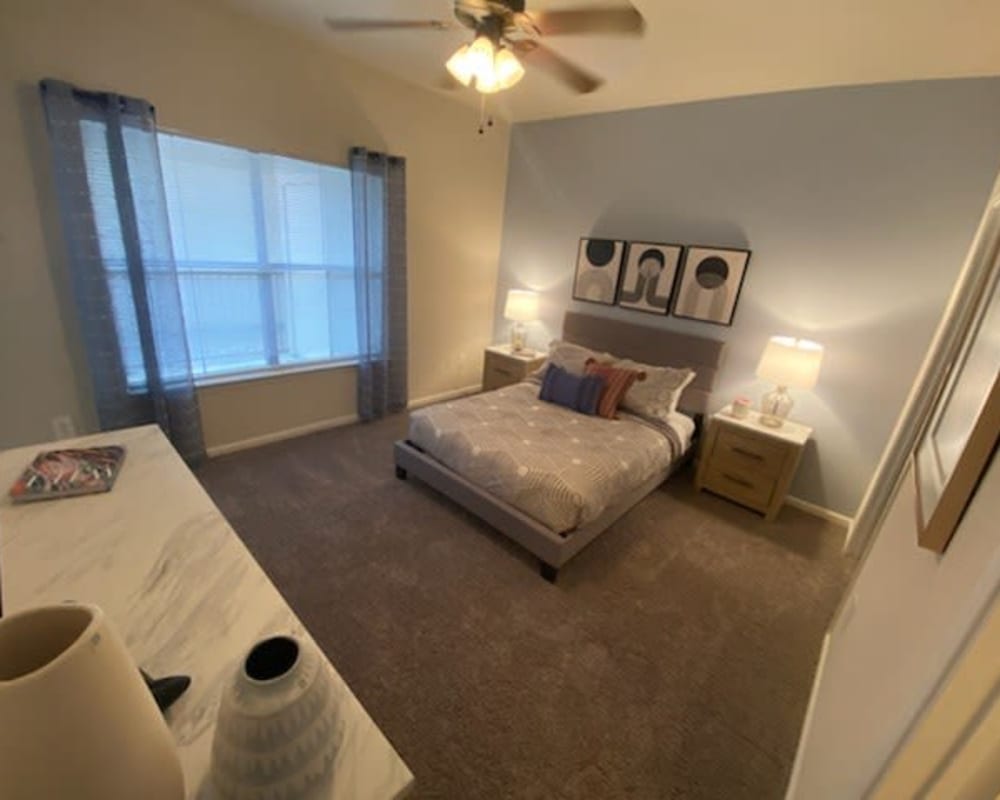 Model bedroom at Legacy of Cedar Hill Apartments & Townhomes in Cedar Hill, Texas.