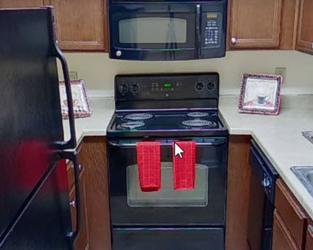 Kitchen with black appliances at Post Ridge in Phenix City, Alabama
