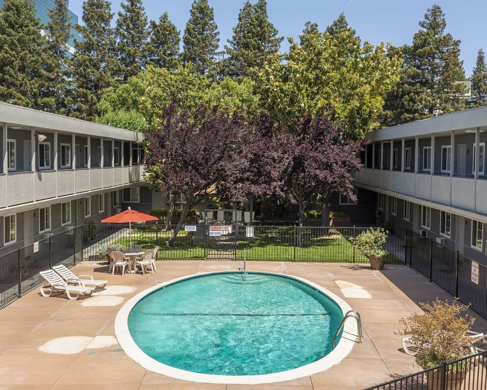 Swimming pool and lounge chairs at City Walk Apartments in Concord, California