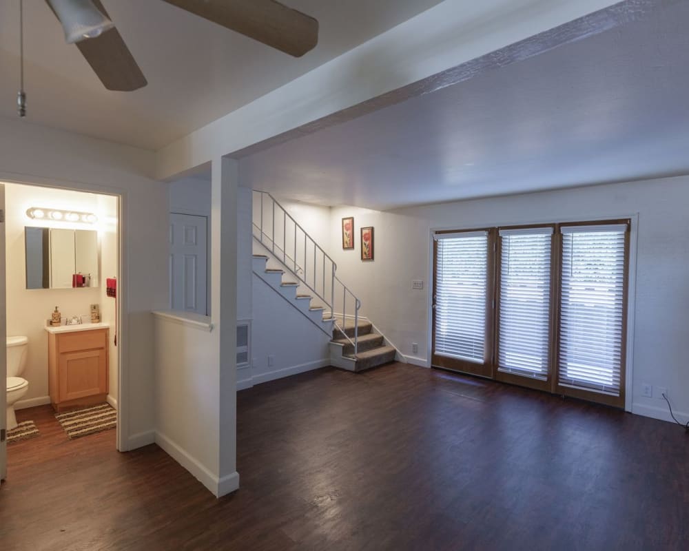 Model townhome with wood-style flooring at Washington Townhomes in San Lorenzo, California