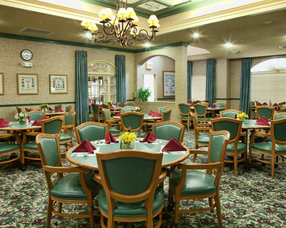 Carpeted dining hall at Carriage Inn Katy in Katy, Texas