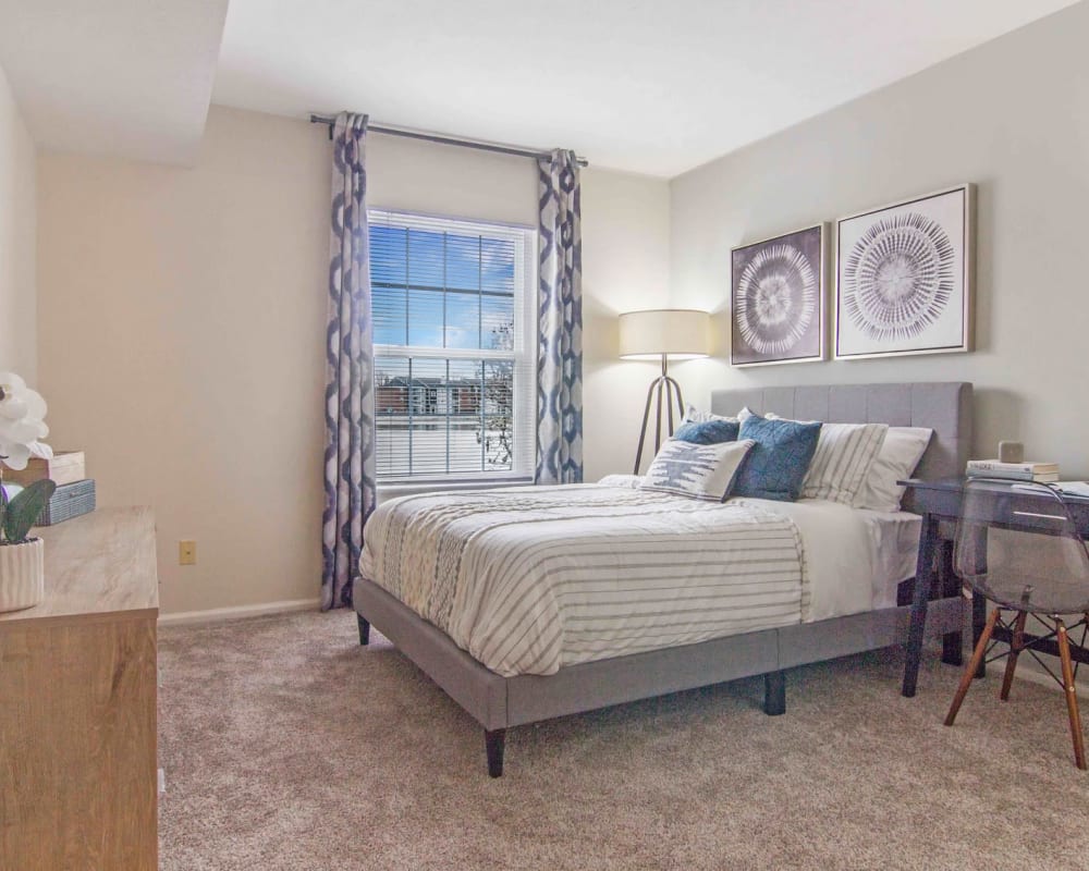 Luxurious and spacious bedroom with access to natural lighting at Hidden Lakes Apartment Homes in Miamisburg, Ohio
