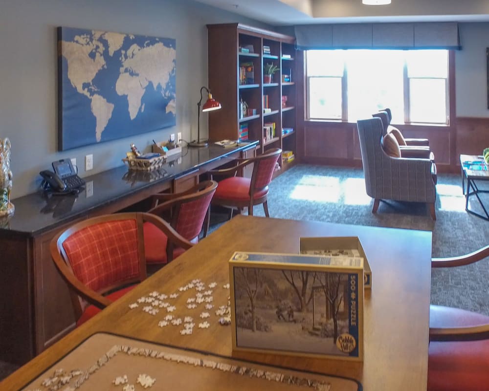 Resident game room with puzzles at The Pillars of Mankato in Mankato, Minnesota
