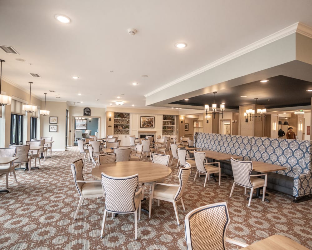 Resident dining hall with plenty of seating at The Pillars of Lakeville in Lakeville, Minnesota