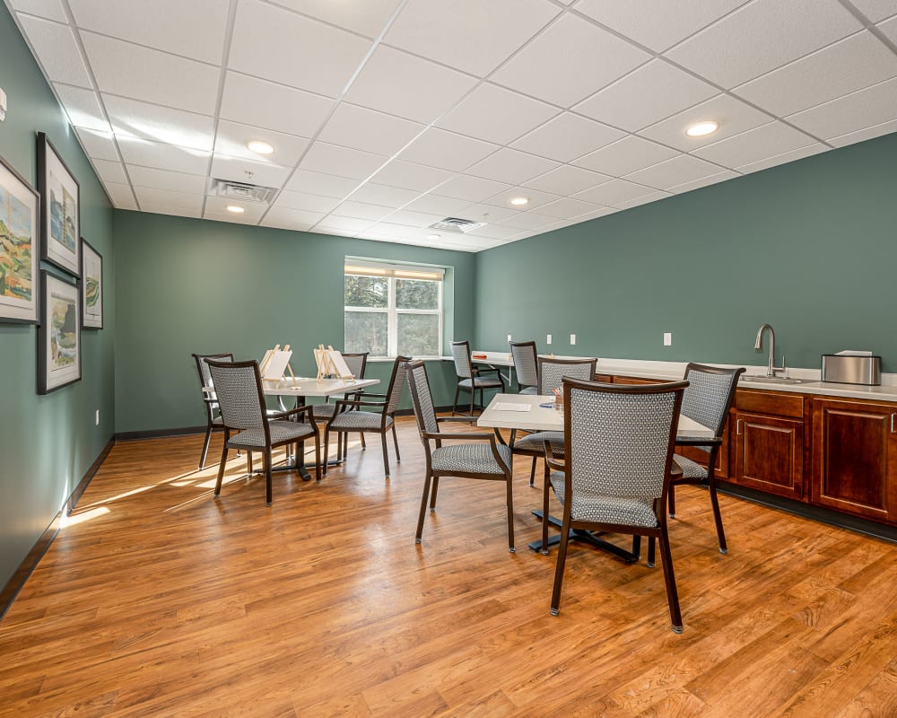 Resident craft room with easels and canvas for painting at The Pillars of Grand Rapids in Grand Rapids, Minnesota