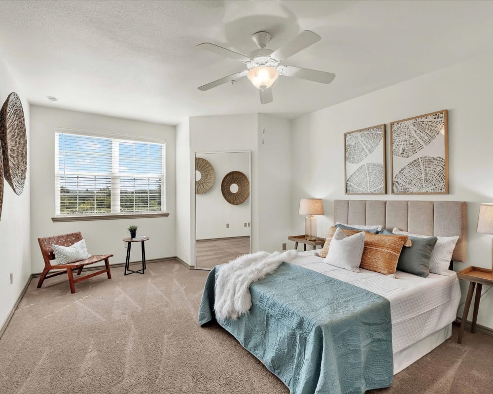 Bedroom with ceiling fan at Villas in Westover Hills in San Antonio, Texas