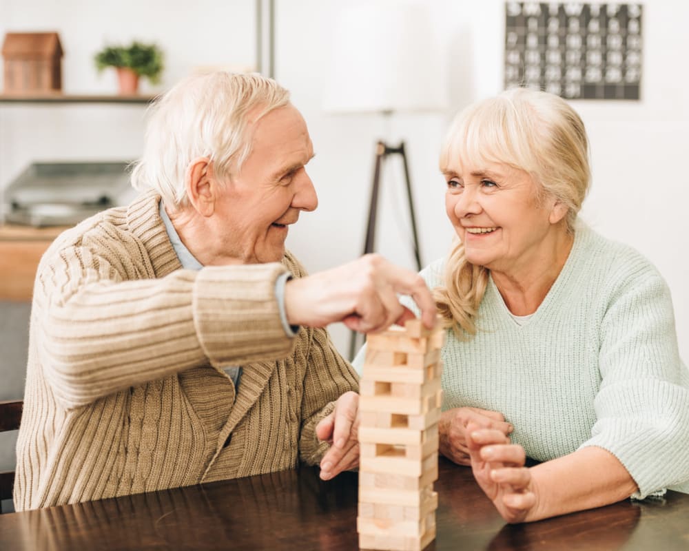 Residents playing Jenga at home at Integrated Senior Lifestyles in Southlake, Texas