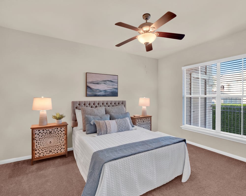 Bedroom with ceiling fan at Sedona Ranch Apartments in San Antonio, Texas