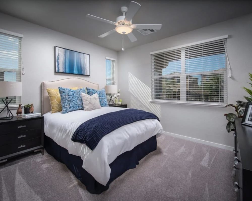 Large bedroom with a ceiling fan at Harvest at Fiddyment Ranch in Roseville, California