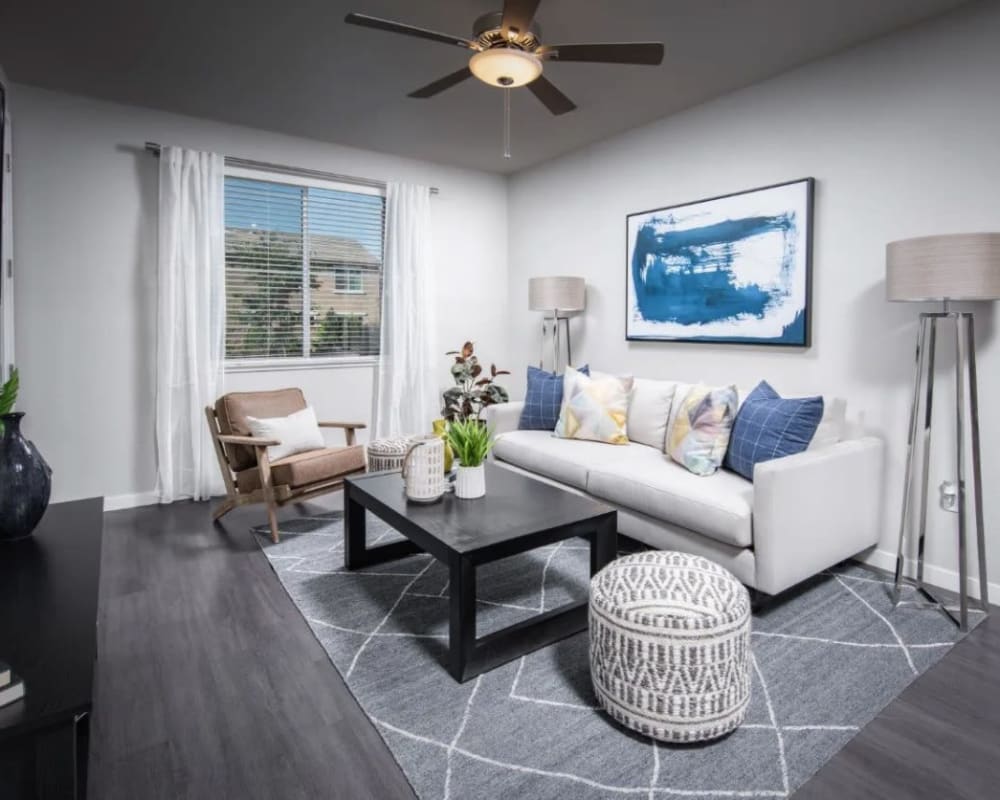 Spacious living room with ceiling fan at Harvest at Fiddyment Ranch in Roseville, California