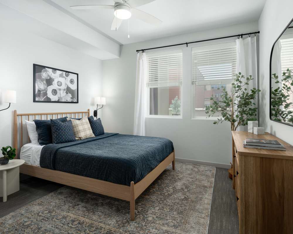 A spacious bedroom with a bed and a desk at SoCo Apartments in Napa, California