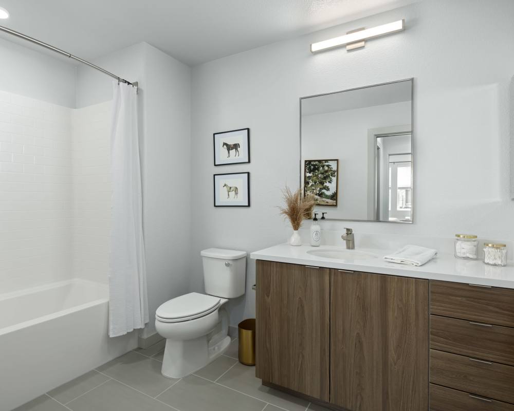 A bathroom with a sink toilet and bathtub at SoCo Apartments in Napa, California