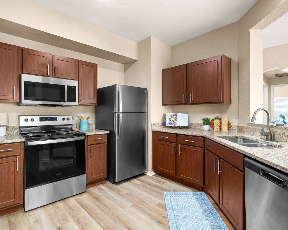 Kitchen with stainless steel appliances at Villas at Oakwell Farms in San Antonio, Texas