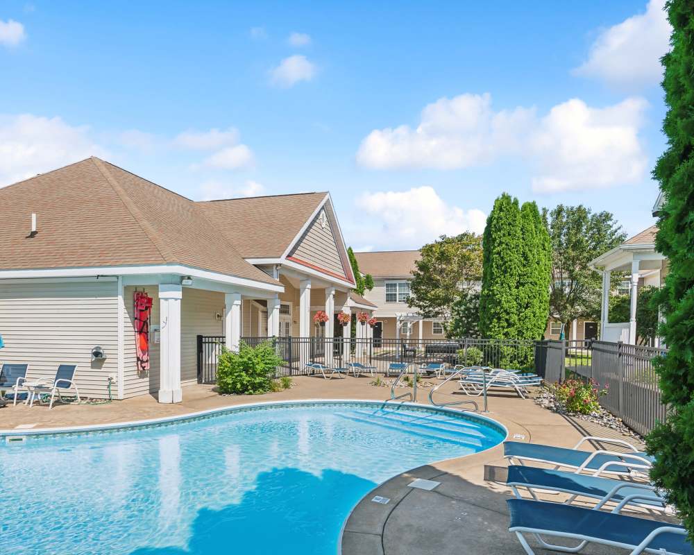 Fenced swimming pool area at Eagle Rock Apartments & Townhomes at Rensselaer in Rensselaer, New York